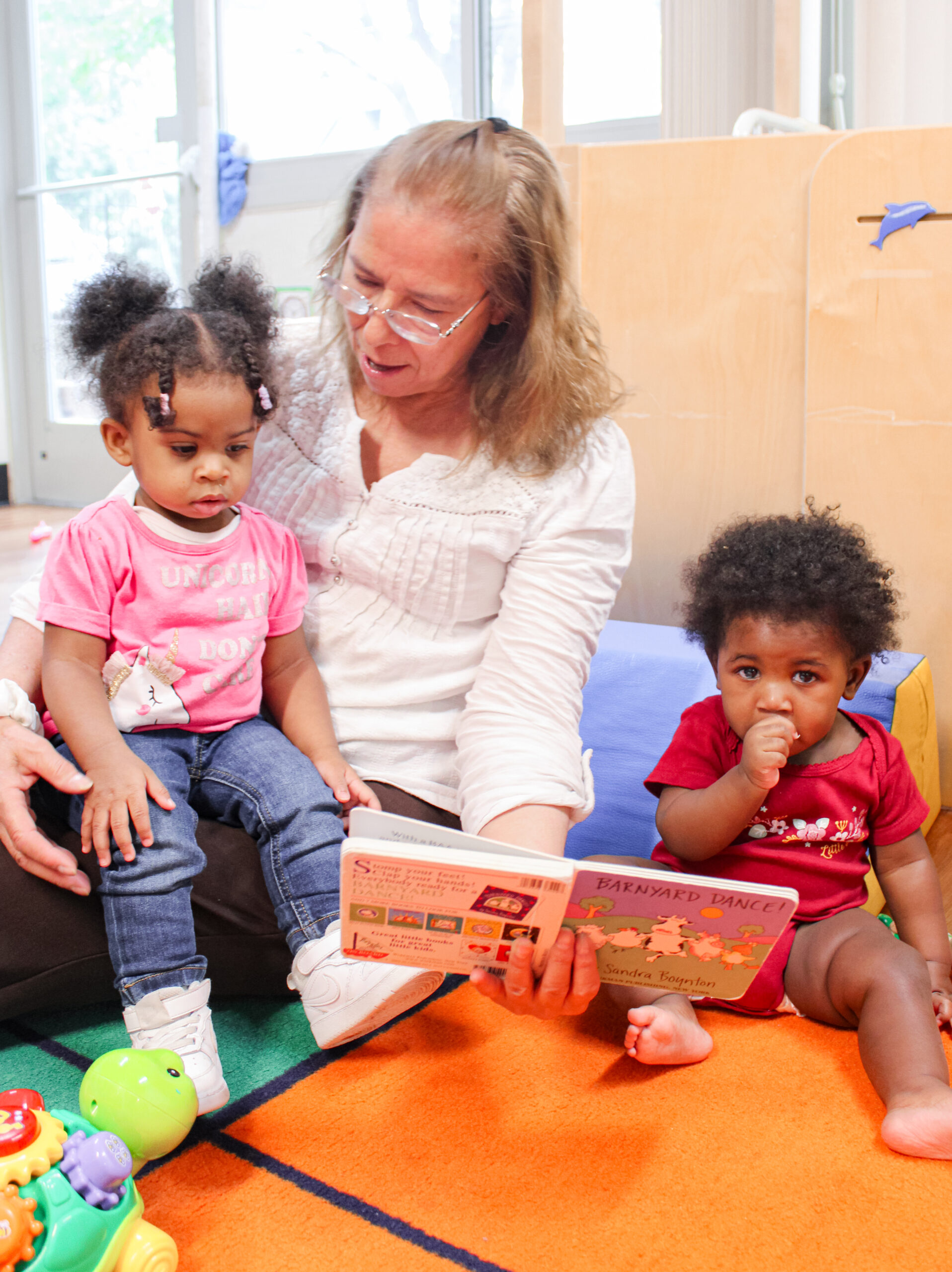 A teacher with children at the Gilpin Early Learning Center