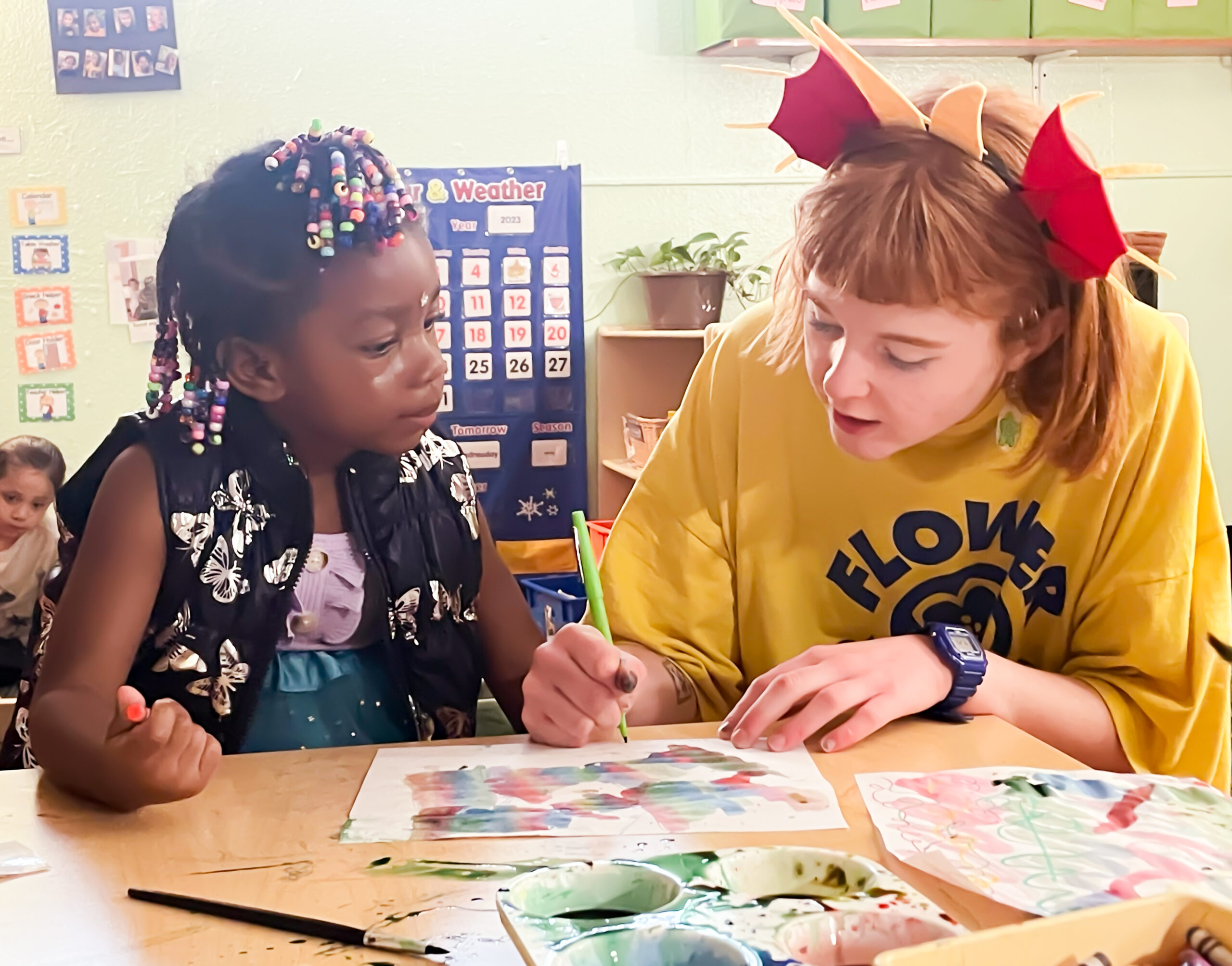 A teacher and child in a Warren Village Early Learning Center classroom