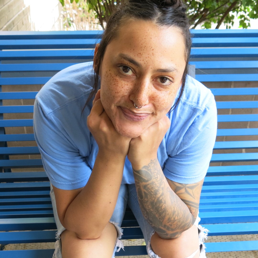 Gabby B. Warren Village resident on bench