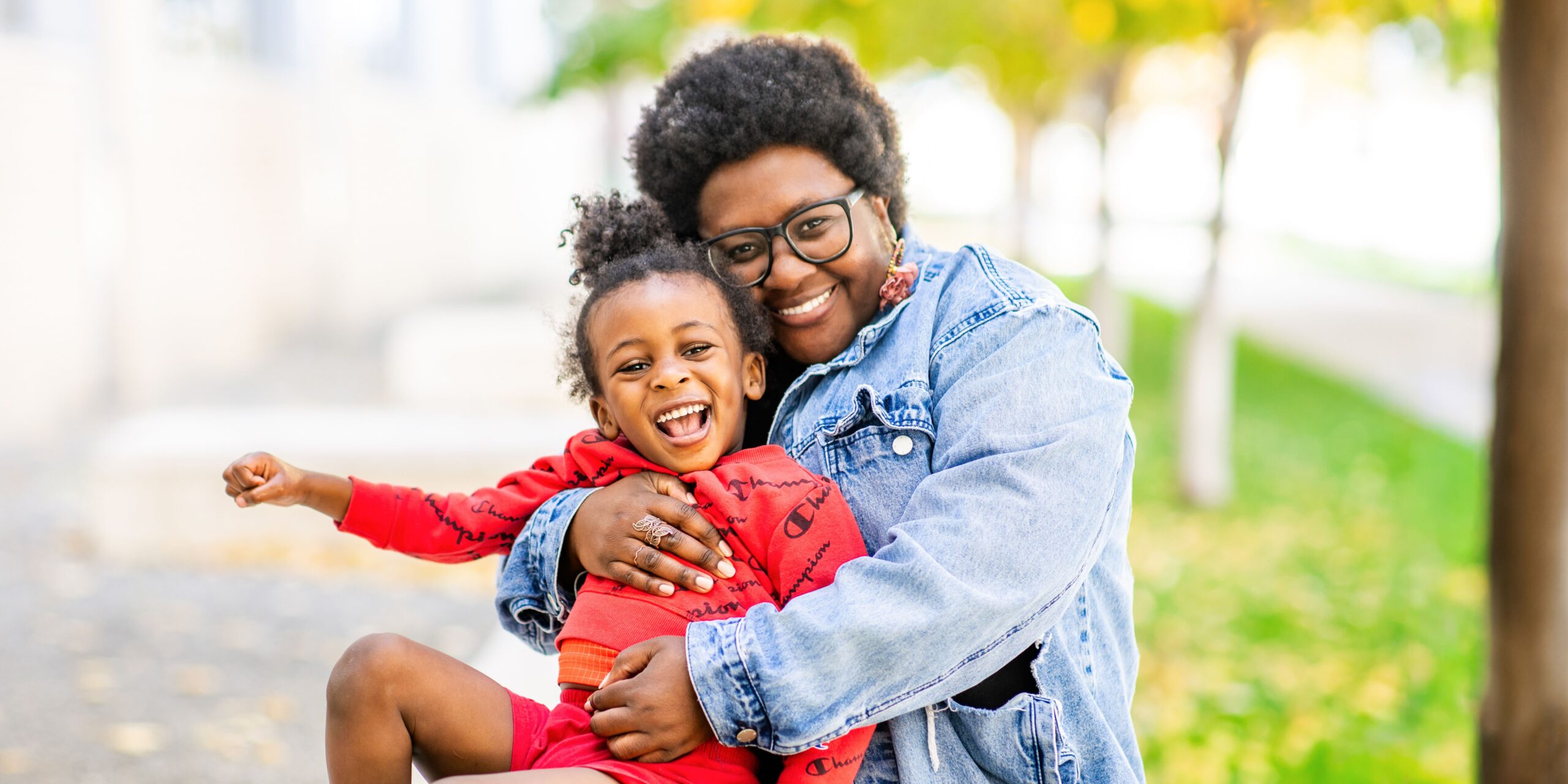 Neema and her son Nehemiah smiling together