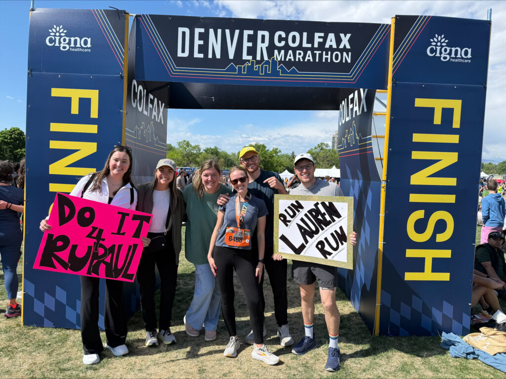 Supporters cheering on Lauren and Warren Village at the Colfax Marathon