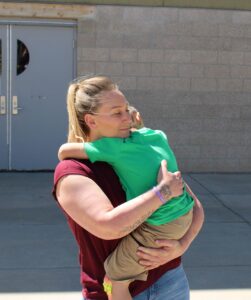 Jessica holding her son.